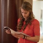 Woman reading the program at the reception